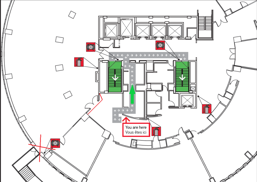 Map indicating new route to emergency exit through the women's bathrooms leading to the exit stairs located in front of the elevators