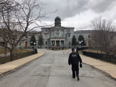 Security agent walking on empty McGill campus