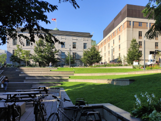 The James Square. A terraced square with grass, a stairs on the left-hand side and bicycles in the bottom of the photo.
