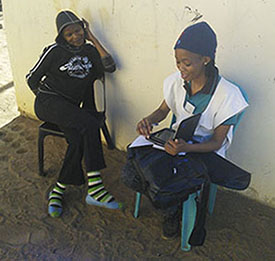 Fieldworkers use android tablets to enter survey responses Fieldworkers use android tablets to enter survey responses