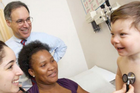 Doctor with patient and family, and child
