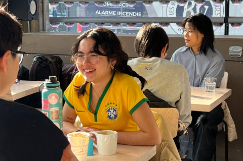Students talking at tables