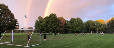 Intermural soccer under a double rainbow