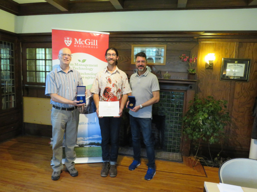 Robbie Love receiving his medals from FMT director Pascal Theriault and associate director David Wees.