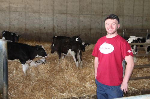 Devin poses at Mars Dairy in Stettler, AB where he spent his summer working as part of the Agricultural Internship course (photo: Caroline Begg)