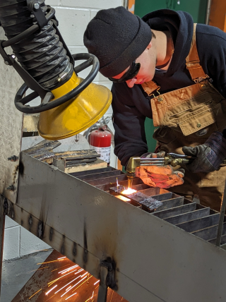 Student torch cutting