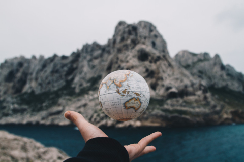 Person throwing a globe