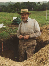 Tim Moore standing in a freshly dug hole