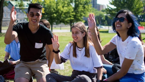 Students raising hands