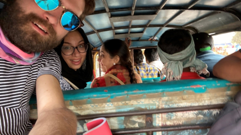 Group selfie inside a vehicle in India