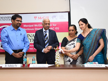 From left to right, Dr. Madhu Pai, Dr. Vinod Bhat, Dr Poornima Baliga, Dr Kavitha Saravu lighting a candle 