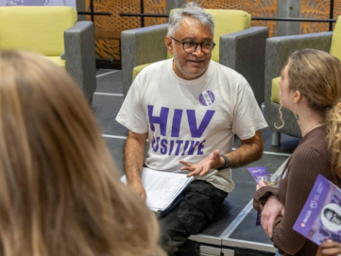 portrait of Global Health Night Keynote speaker Zackie Achmat speaking to students at Global Health Night 2025