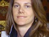 Young female doctor from Brazil, long hair, pensive look