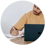 Student taking notes and writing
