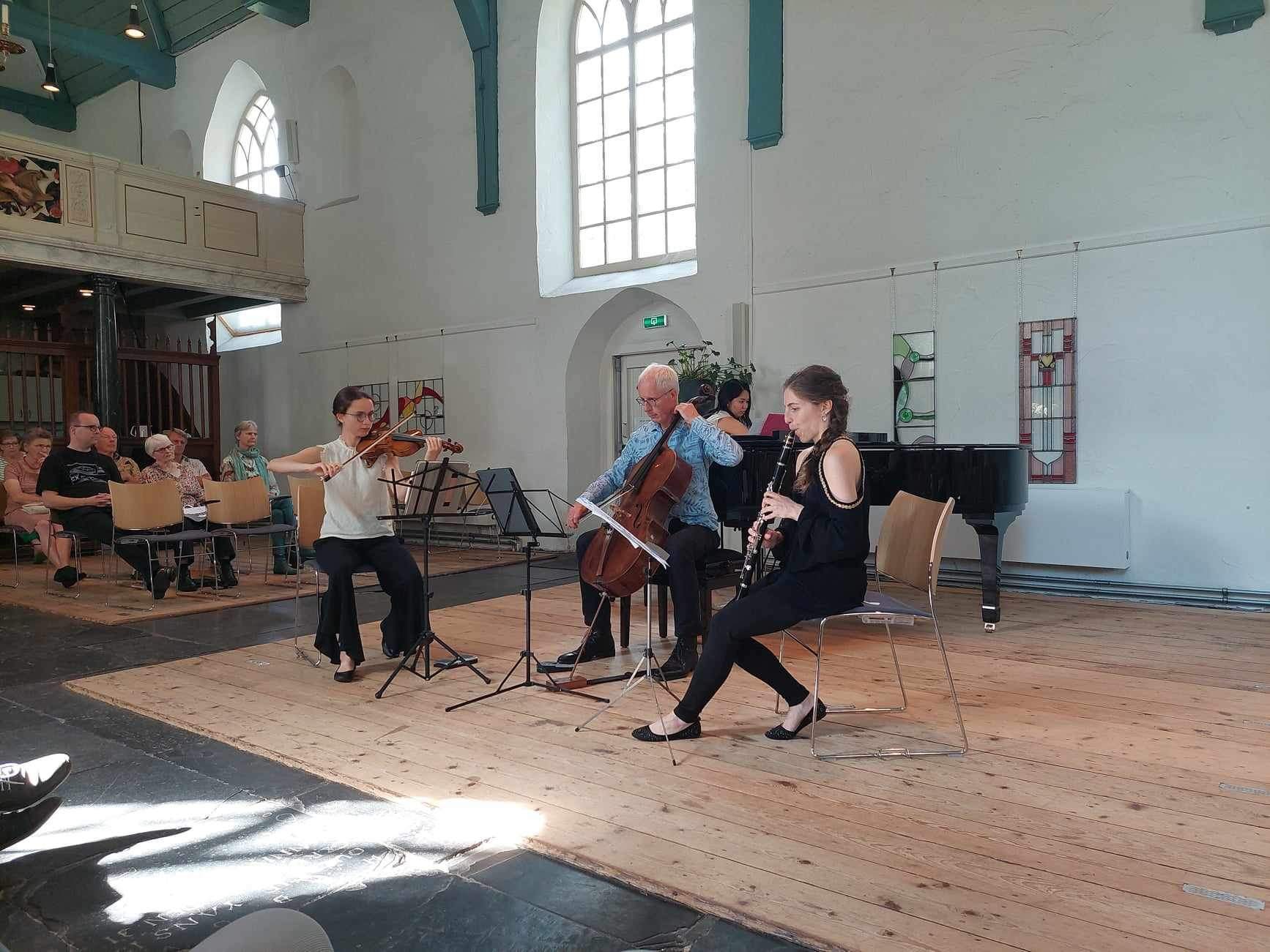 Four musicians performing at a concert.