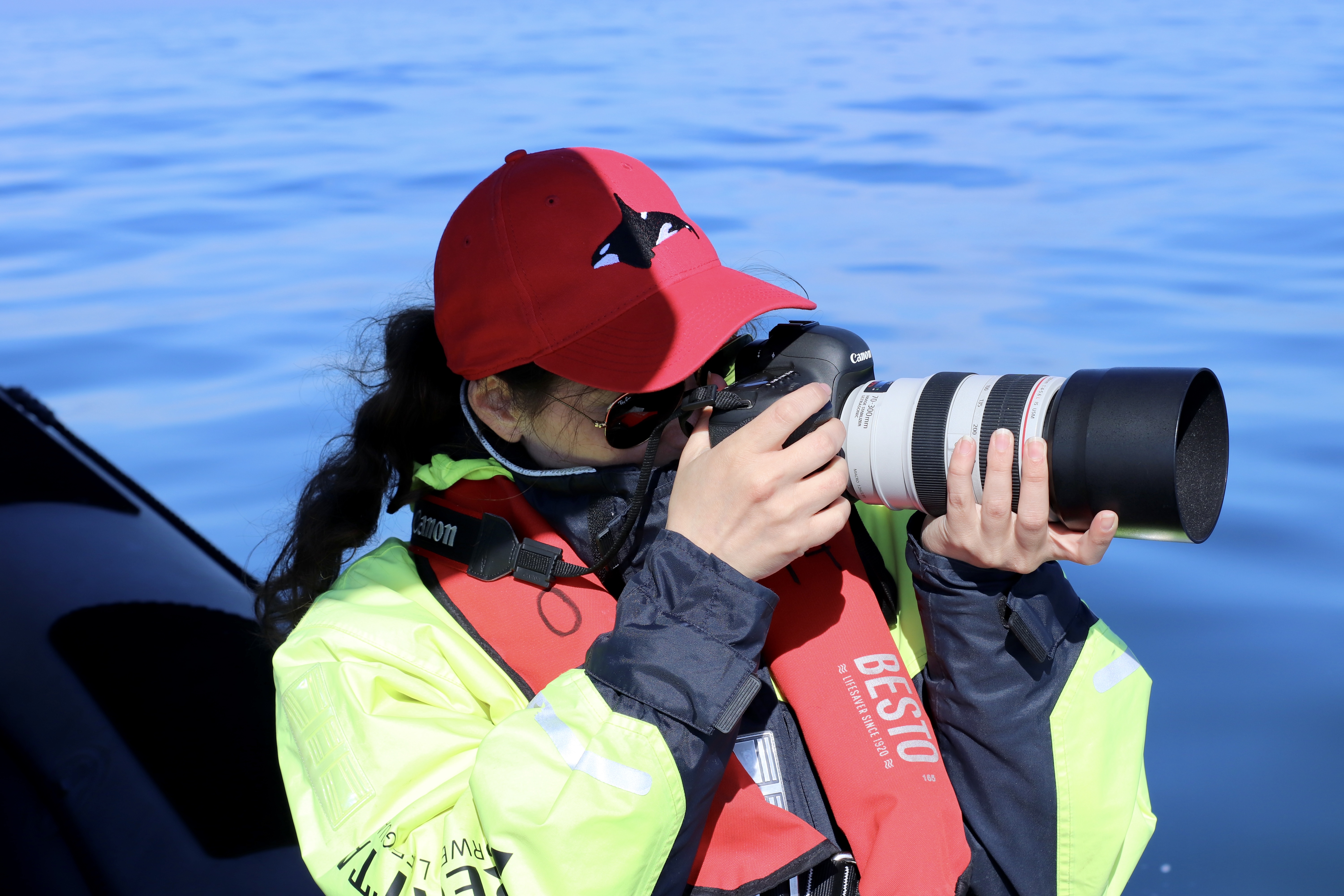 Anaïs taking photos of the whale's 