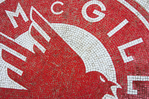 Tiled red and white McGill Crest from McGill Athletics floor