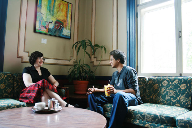 A student and supervisor sit in Thomson house having a conversation