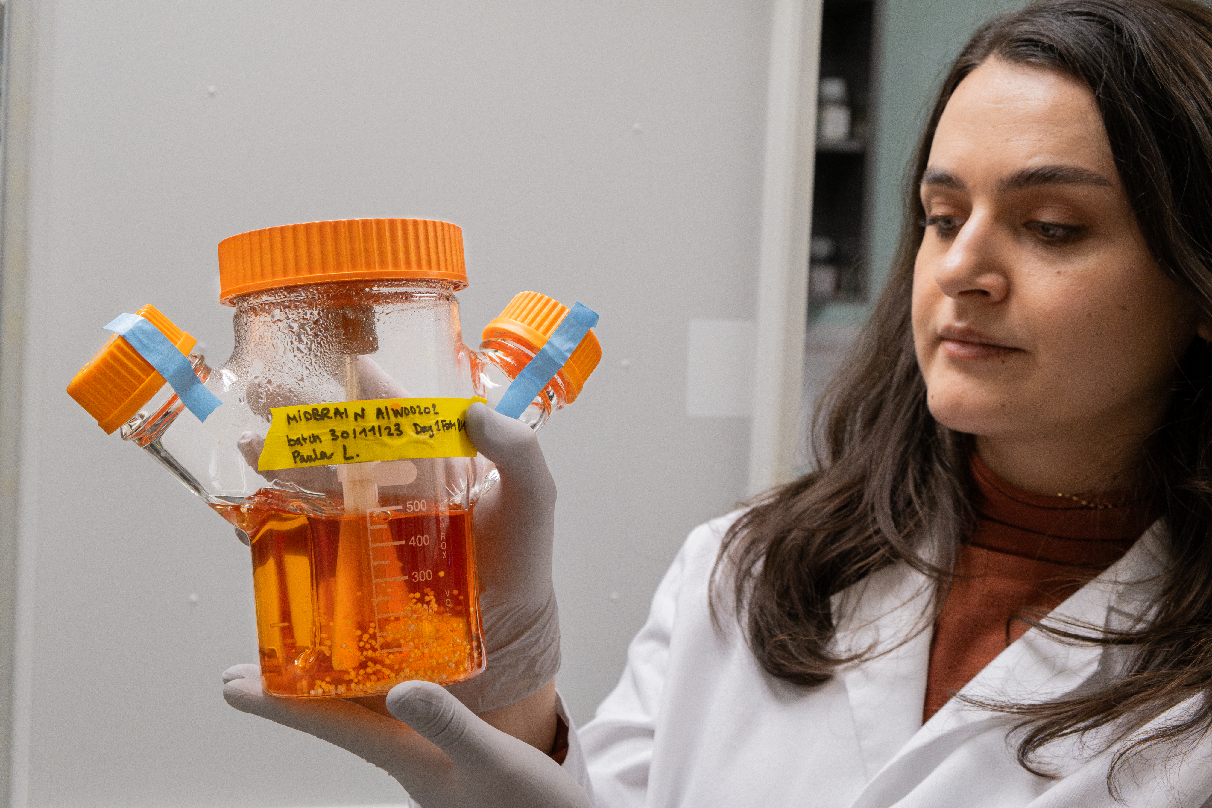Paula Lépine showcases a brain organoid culture in a bioreactor that she personally cultivated.