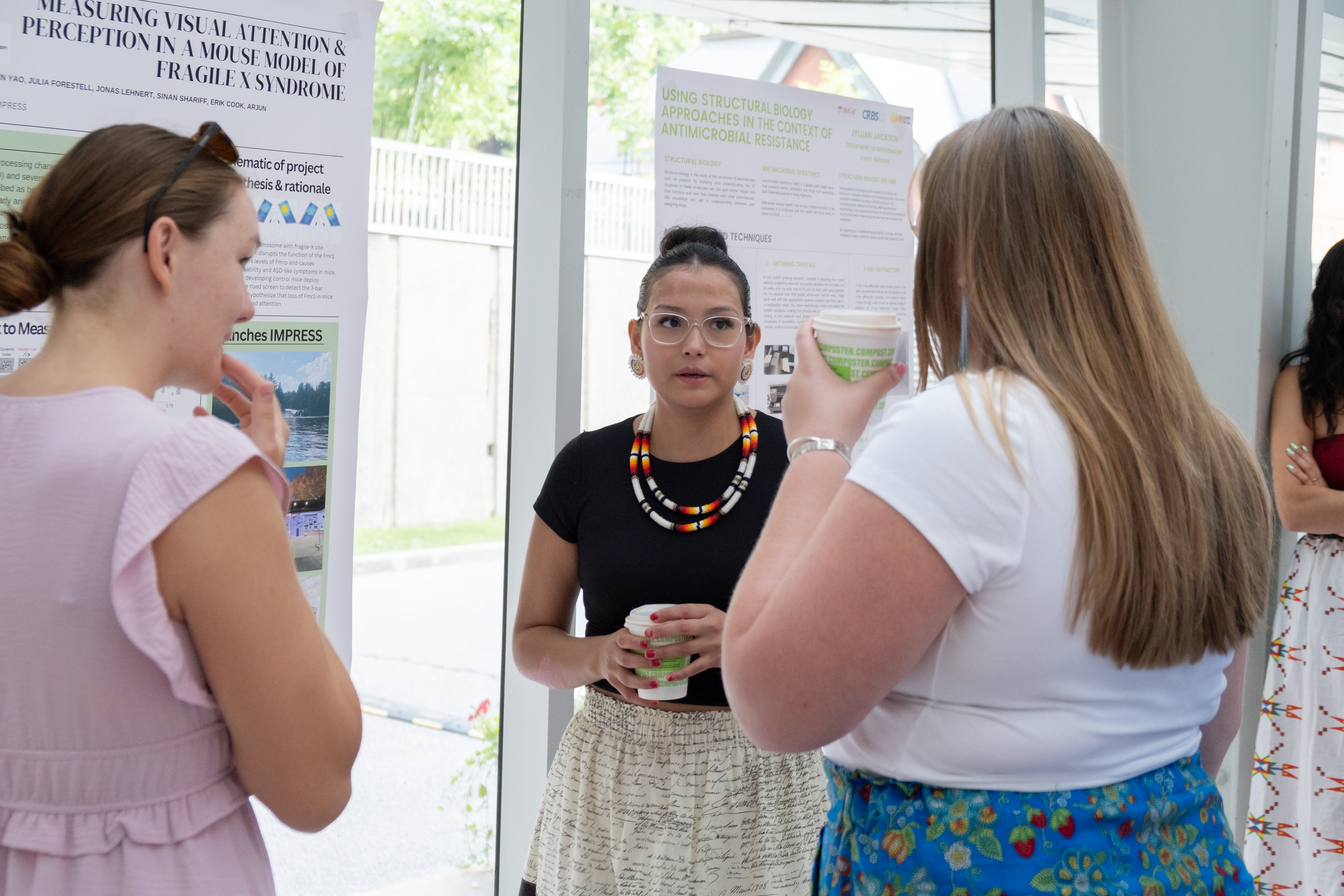 Students in front of poster at IMPRESS Research Day