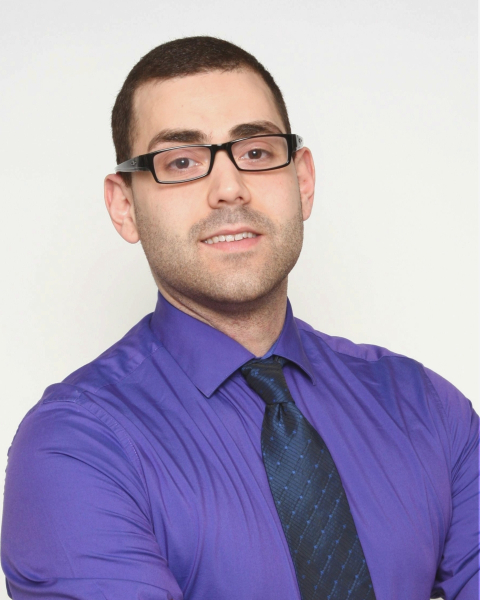 Headshot of Daniel Almeida, PhD student at the Douglas Research Centre, in a dark violet shirt. 