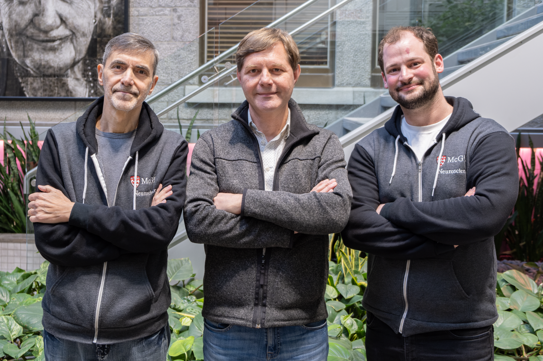 Three men posing with arms crossed. From left to right: Ariel Ase, PhD, Research Associate (Co-inventor IP), Philippe Séguéla, PhD, Full Professor in the Department of Neurology and Neurosurgery at McGill (Project lead) and Jonas Friard, PhD, Postdoctoral Researcher. 