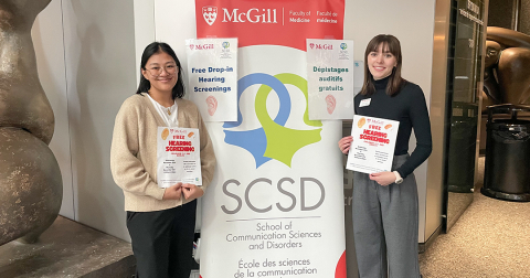 Two speech-language pathology students offering hearing screenings on McGill campus