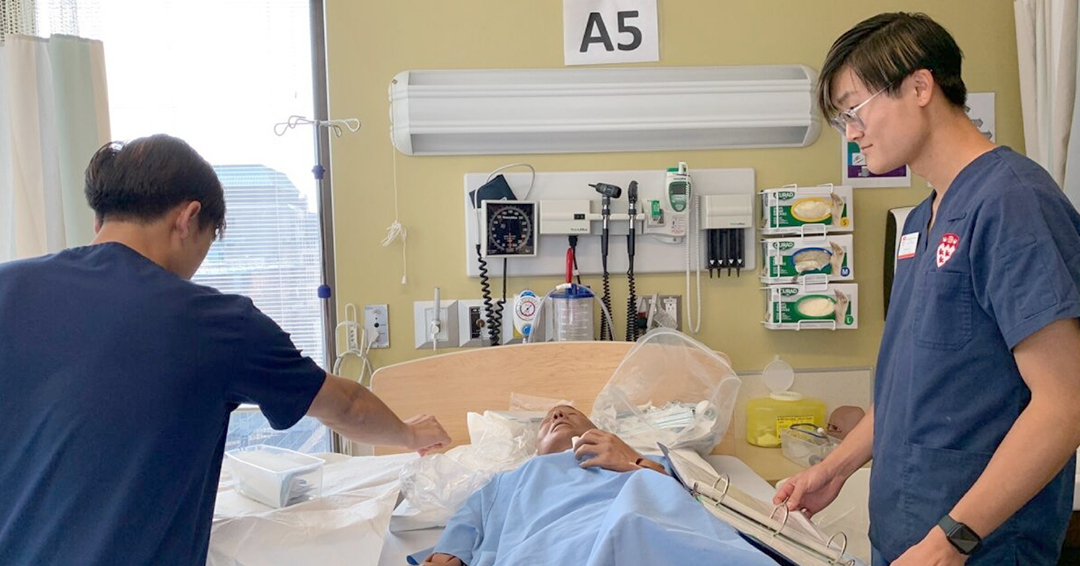 Nursing students take part in a simulation scenario