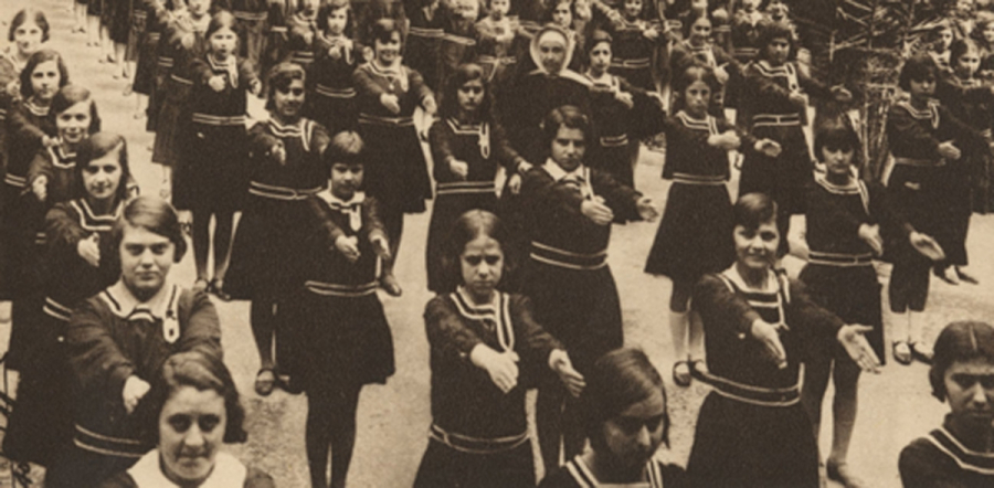 Children in uniform performing a drill
