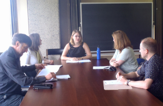 Dissertation Commitee discussing around a table