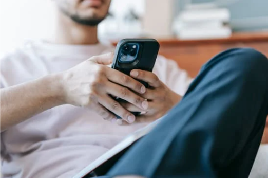 A person using a mobile phone