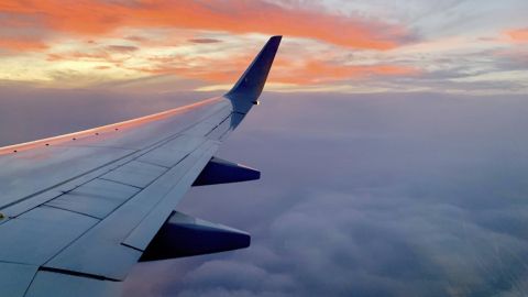 Wing of plane in the sky