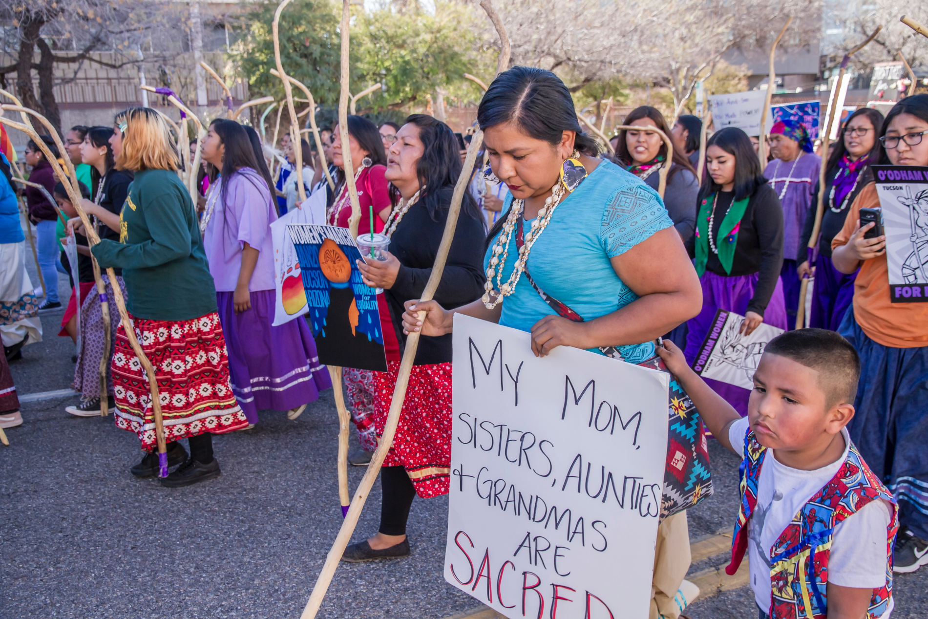 A group of indigenous women marching and protesting. 