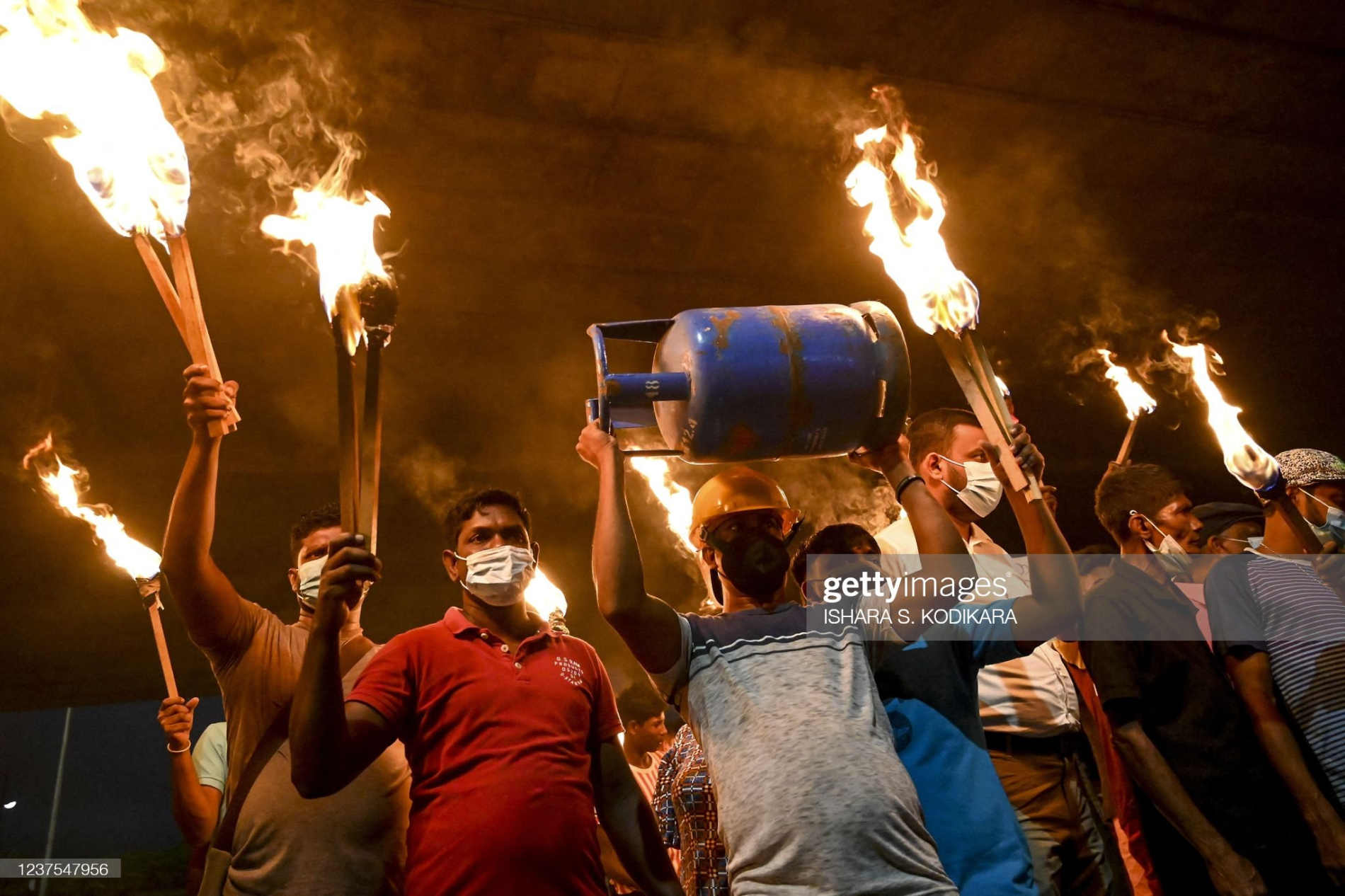 crowd marching with torches in skri lanka