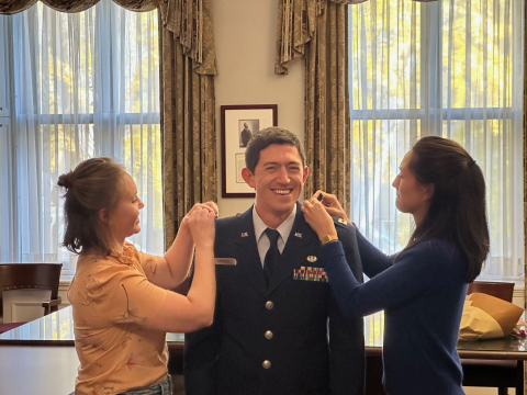 Maj. Matthew Ormsbee being decorated by his family members at McGill University