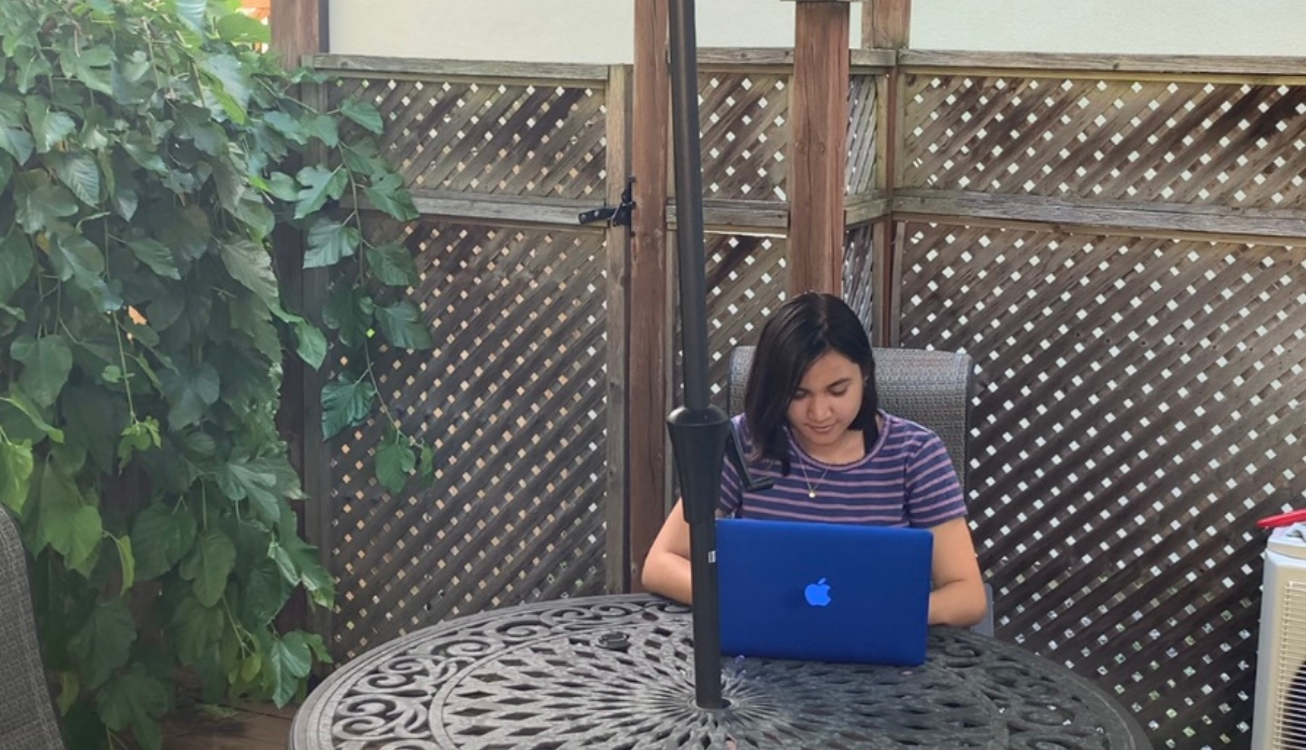 Anjali completing some research on the porch
