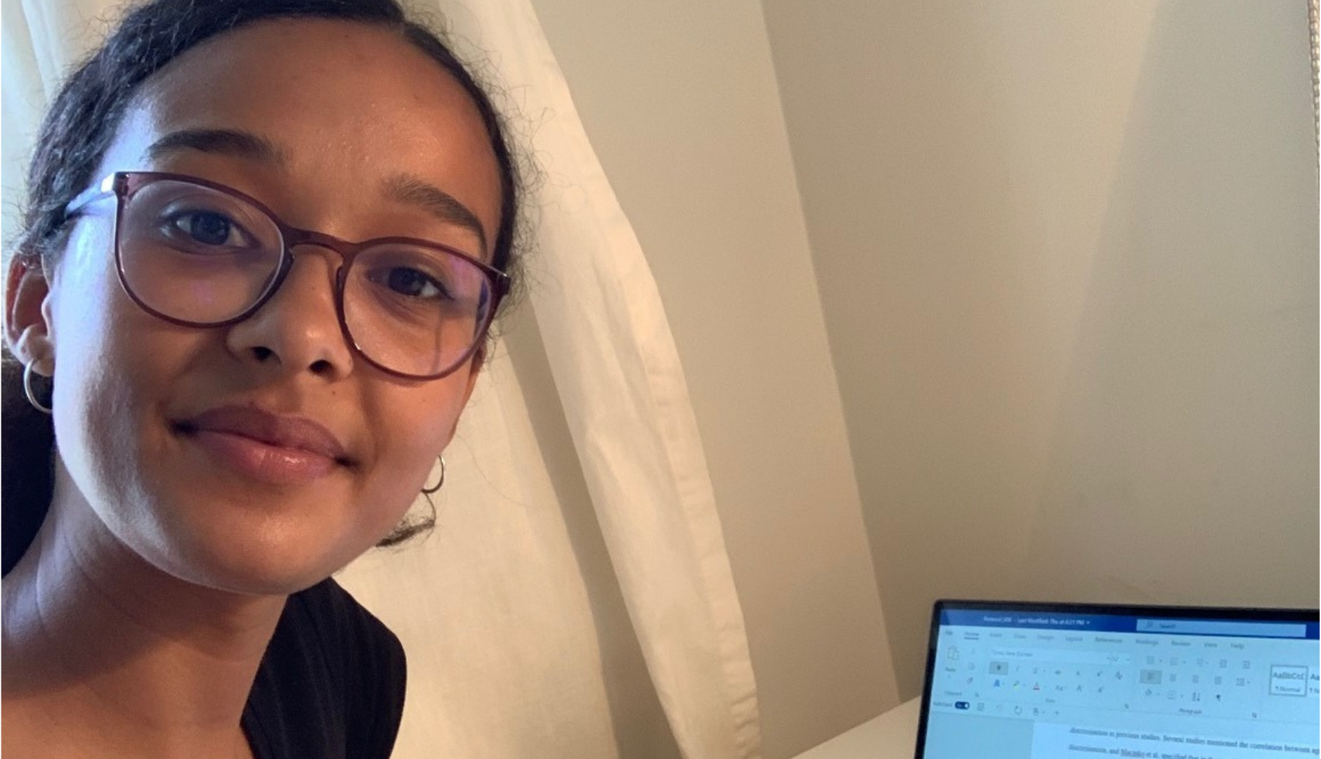 Layla working from her laptop
