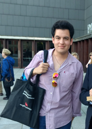Angello holding a library bag