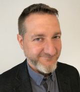 Prof Max Denis headshot
