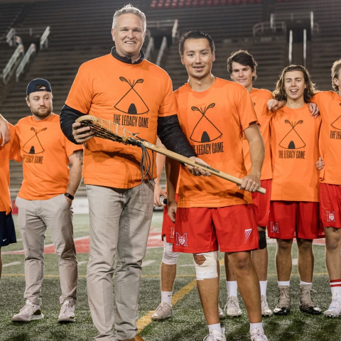 Lacrosse players in orange 