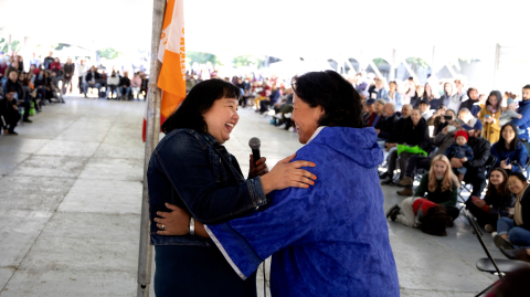 Two Inuit women are shown throat singing at the McGill pow wow in 2022