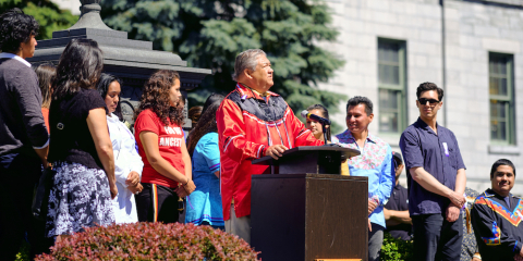 Students at McGill listen to a speaker at an outdoor podium