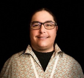 A photo of Codey Martin, a man with brown hair and glasses