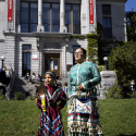 Two women stand at the McGill PowWow 2022. 