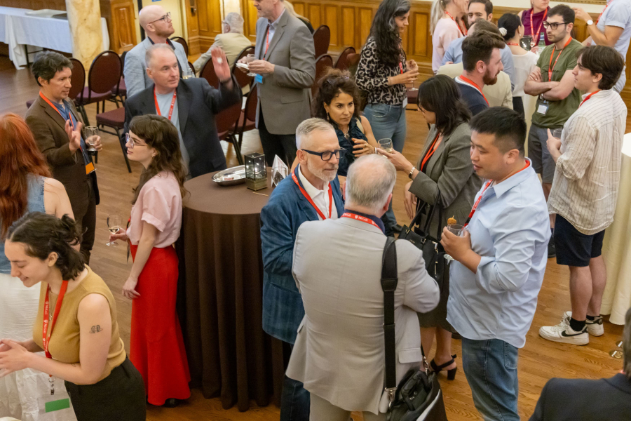 A group of people networking in a classy ballroom