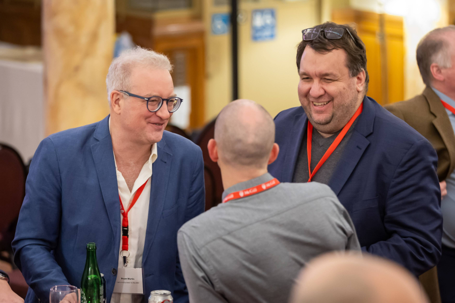 three people talking in a networking setting