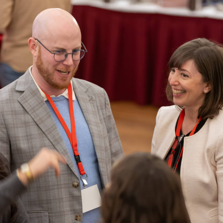three people talking in a networking setting