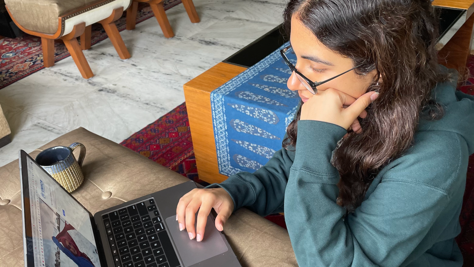 Saisha Vasudeva working on the computer during her internship