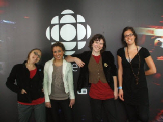Hayley and three other interns in front of the CBC logo.