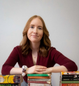 A headshot of Stephanie Cairns with books